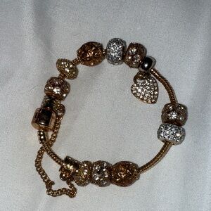 Elegant Gold and Silver Charm Bracelet